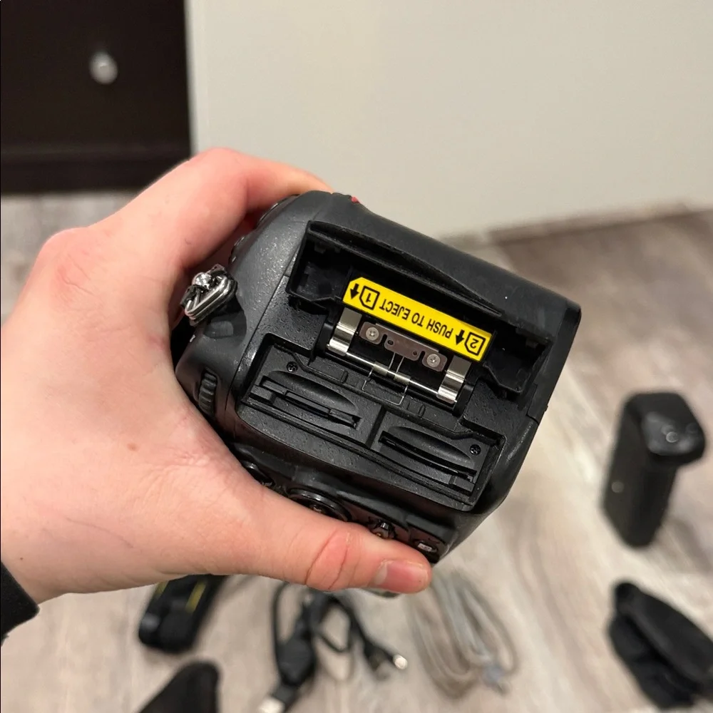 Nikon DSLR D7000 Camera with Black Battery Grip and Accessories